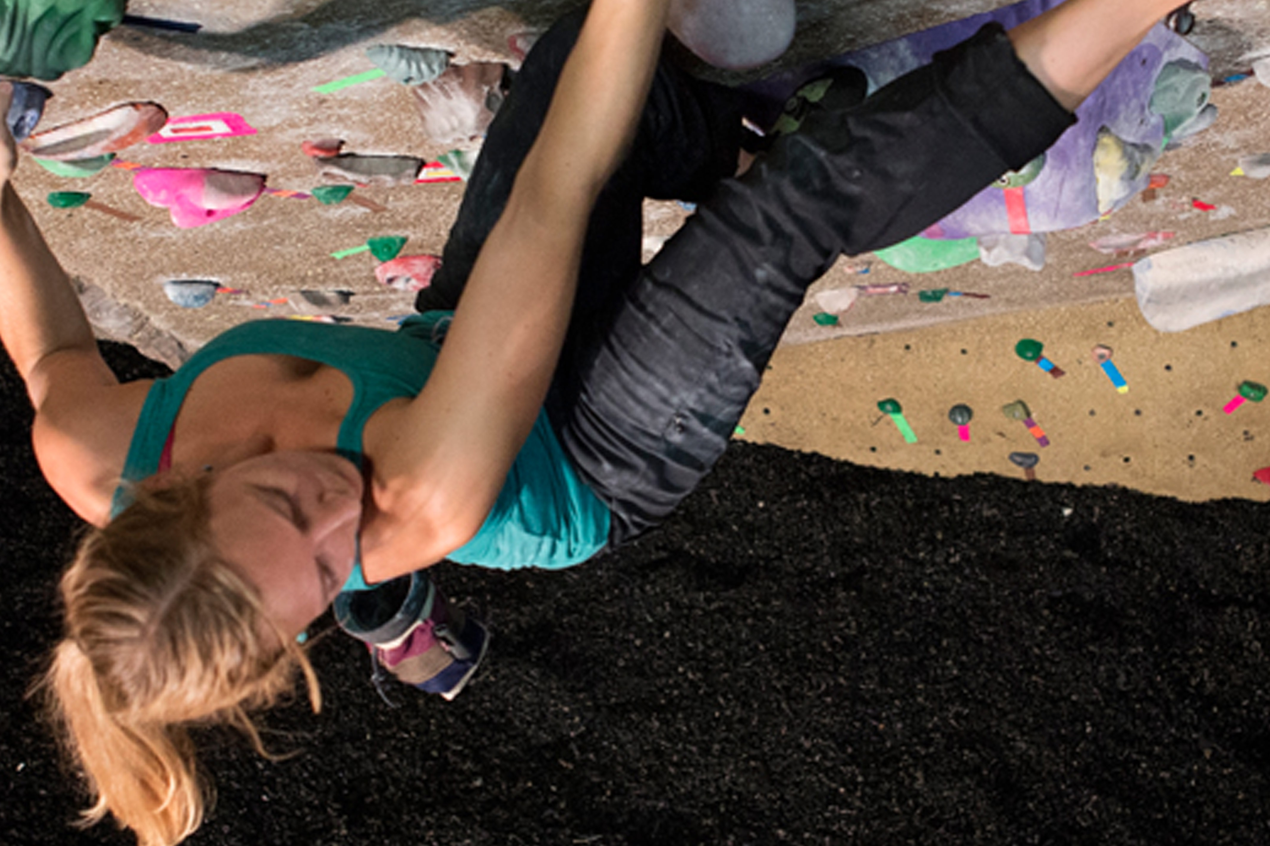 Girl indoor rock climbing