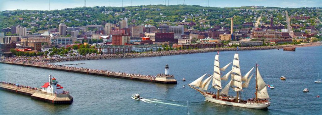 tall old ship entering the harbor in Duluth, MN