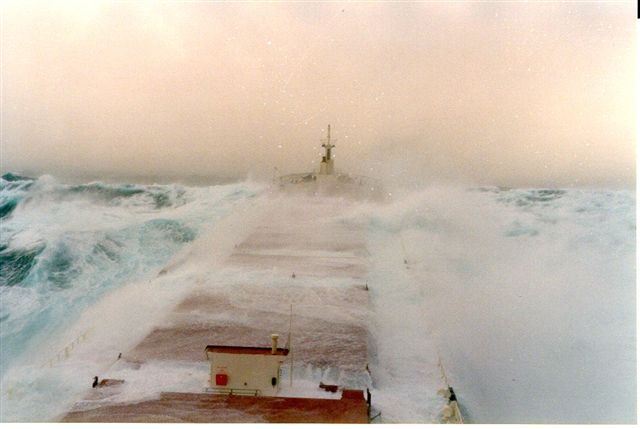 Waves crashing over a ship on Lake Superior