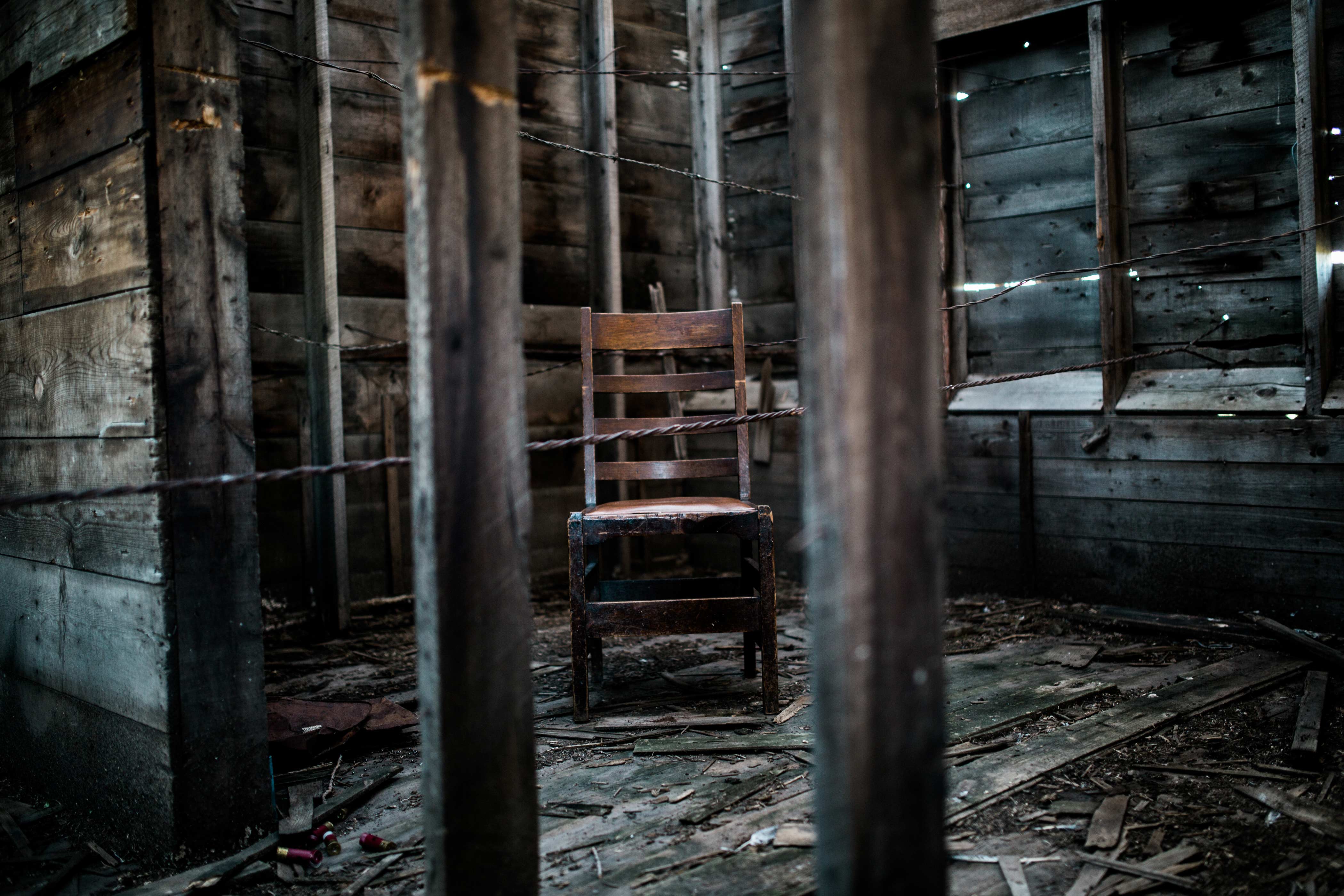 old wooden chair in deserted cabin